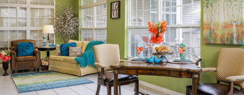 Relax in the warmth of the sunroom at Bickford of Omaha Hickory