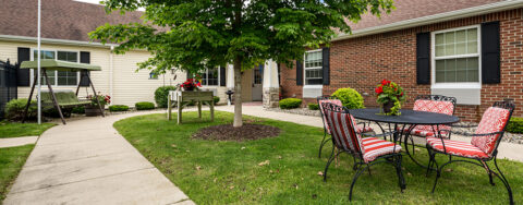 Residents with dementia can enjoy a traveling path, relaxed seating and raised garden beds in the courtyard at Bickford of Battle Creek
