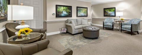 Socialize with a good friend in the sitting area at Bickford of Bexley