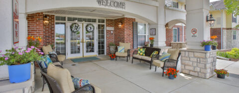 Relax in your favorite chair on the porch at Bickford of Bloomington