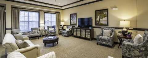 Socialize with friends in the living room at Bickford of Canton