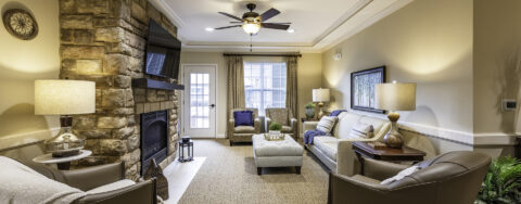 Socialize with a good friend in the sitting area at Bickford of Canton