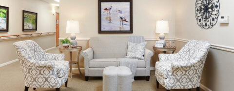 Socialize with a good friend in the sitting area at Bickford of Champaign