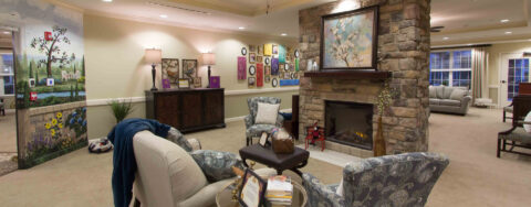 Residents can enjoy furniture covered in cozy fabrics in the Mary B’s living room at Bickford of Gurnee