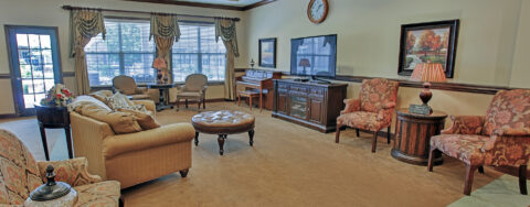 Socialize with friends in the living room at Bickford of Greenwood