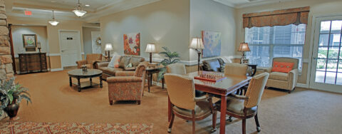 Socialize with a good friend in the sitting area at Bickford of Greenwood