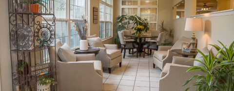 Enjoy the view of the outdoors from the sunroom at Bickford of Iowa City