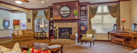 Enjoy a good book in the living room at Bickford of Okemos