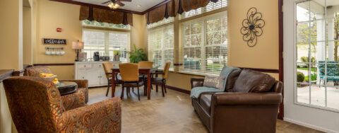 Curl up with a good book in the sunroom at Bickford of Okemos