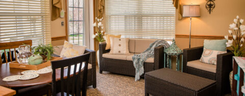 Curl up with a good book in the sunroom at Bickford of Macomb