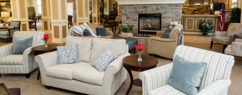 Enjoy a good book in the living room at Bickford of Oswego
