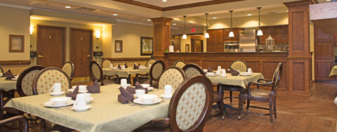 Residents with dementia receive additional assistance with meals in our Mary B’s dining room at Bickford of Portage