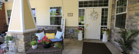Enjoy conversations with friends on the porch at Bickford of Saginaw Township