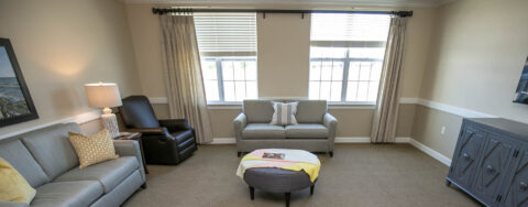 Residents can enjoy furniture covered in cozy fabrics in the Mary B’s living room at Bickford of Saginaw Township