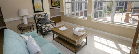 Curl up with a good book in the sunroom at Bickford of Saginaw Township