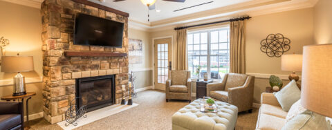 Socialize with a good friend in the sitting area at Bickford of Shelby Township