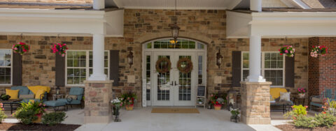 Enjoy conversations with friends on the porch at Bickford of Suffolk