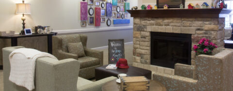 Residents can enjoy furniture covered in cozy fabrics in the Mary B’s living room at Bickford of Tinley Park