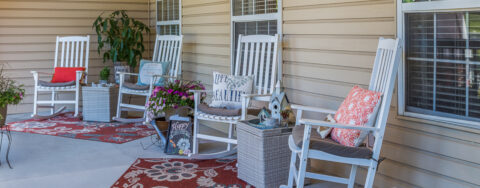 Enjoy conversations with friends on the porch at Bickford of Urbandale