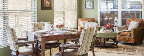 Enjoy the view of the outdoors from the sunroom at Bickford of West Des Moines