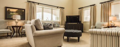 Enjoy a good book in the living room at Bickford of West Lansing