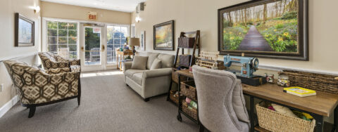 Socialize with a good friend in the sitting area at Bickford of Worthington